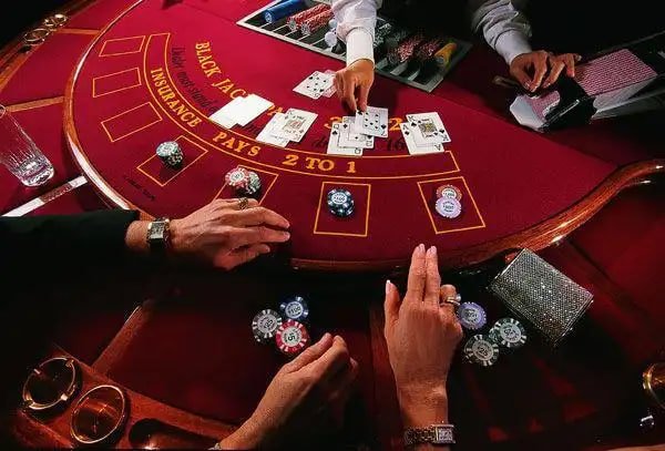Baccarat card shoe on okeslot login studio table